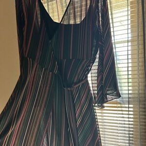 Sheer wrap dress with sheath. Black with multi color stripes.